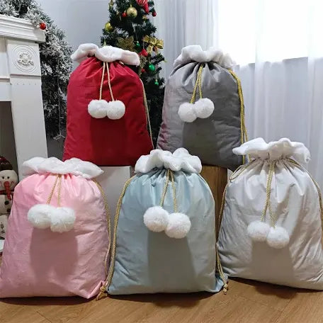 Large velvet Christmas sacks with pom poms